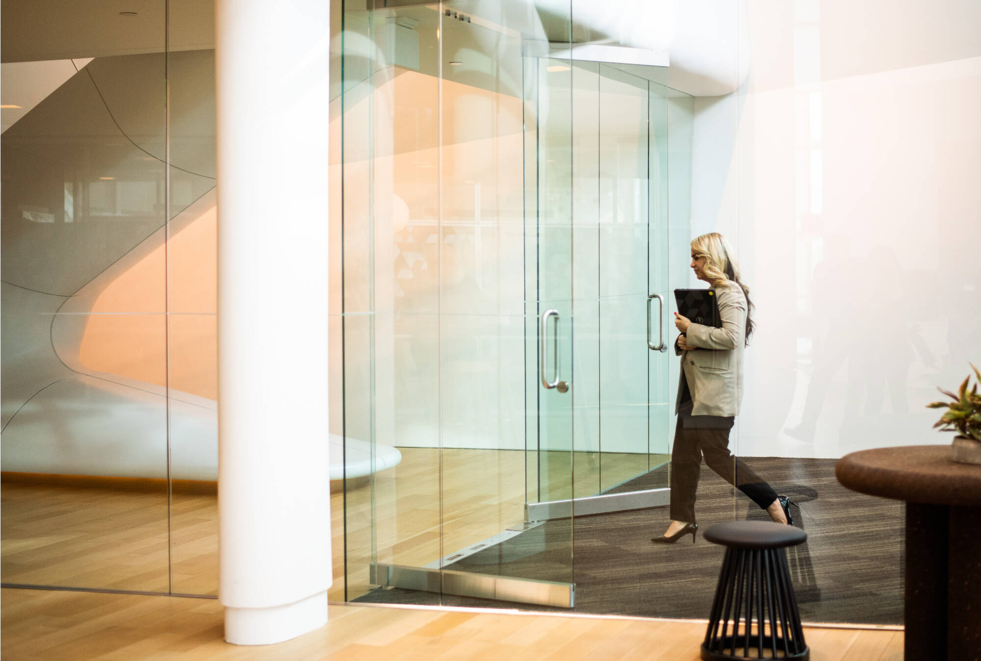 GVSU professor going through the glass doors of Seidman